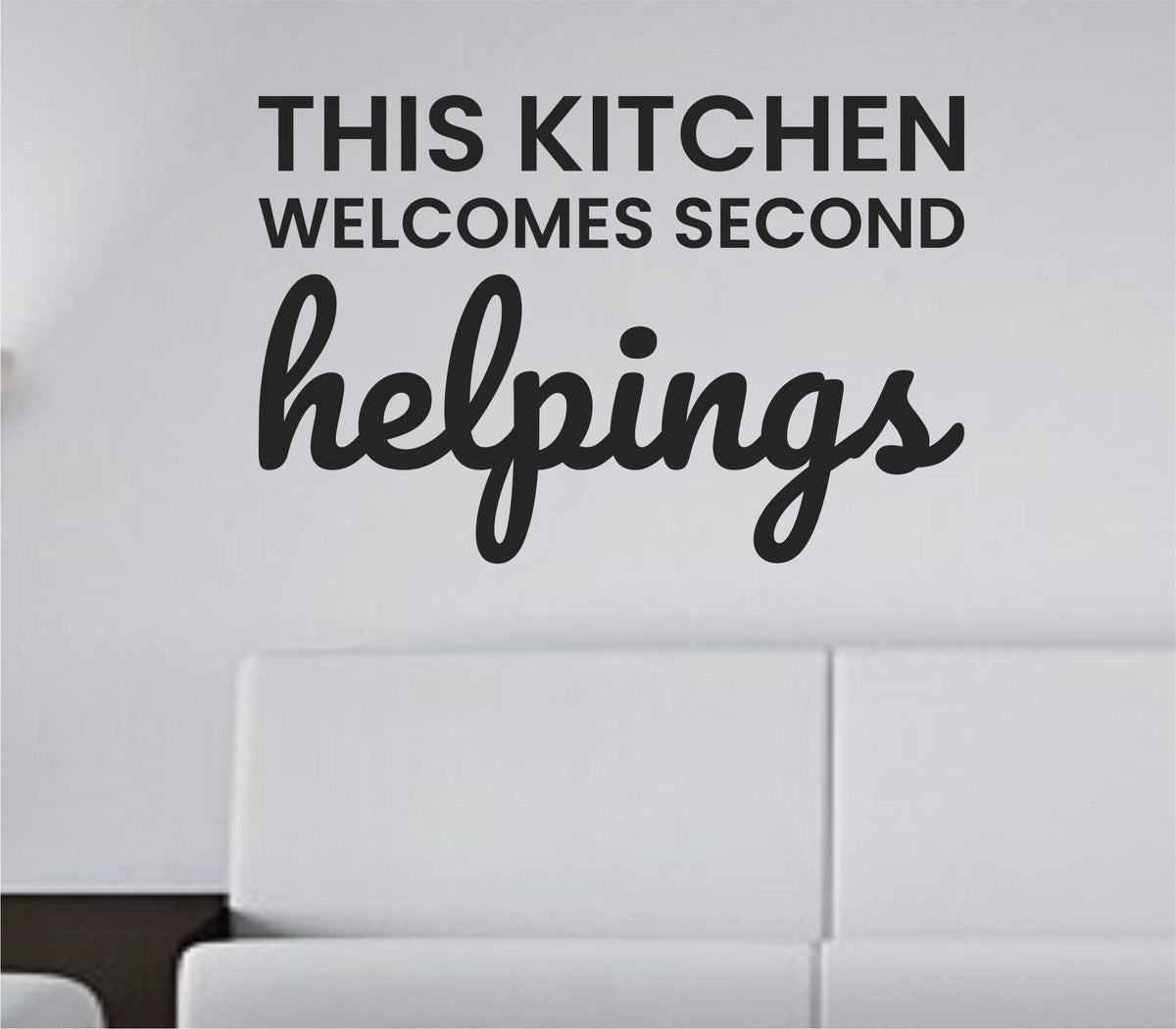 Black vinyl wall decal with the phrase This kitchen welcomes second helpings in a clean, modern font on a white background