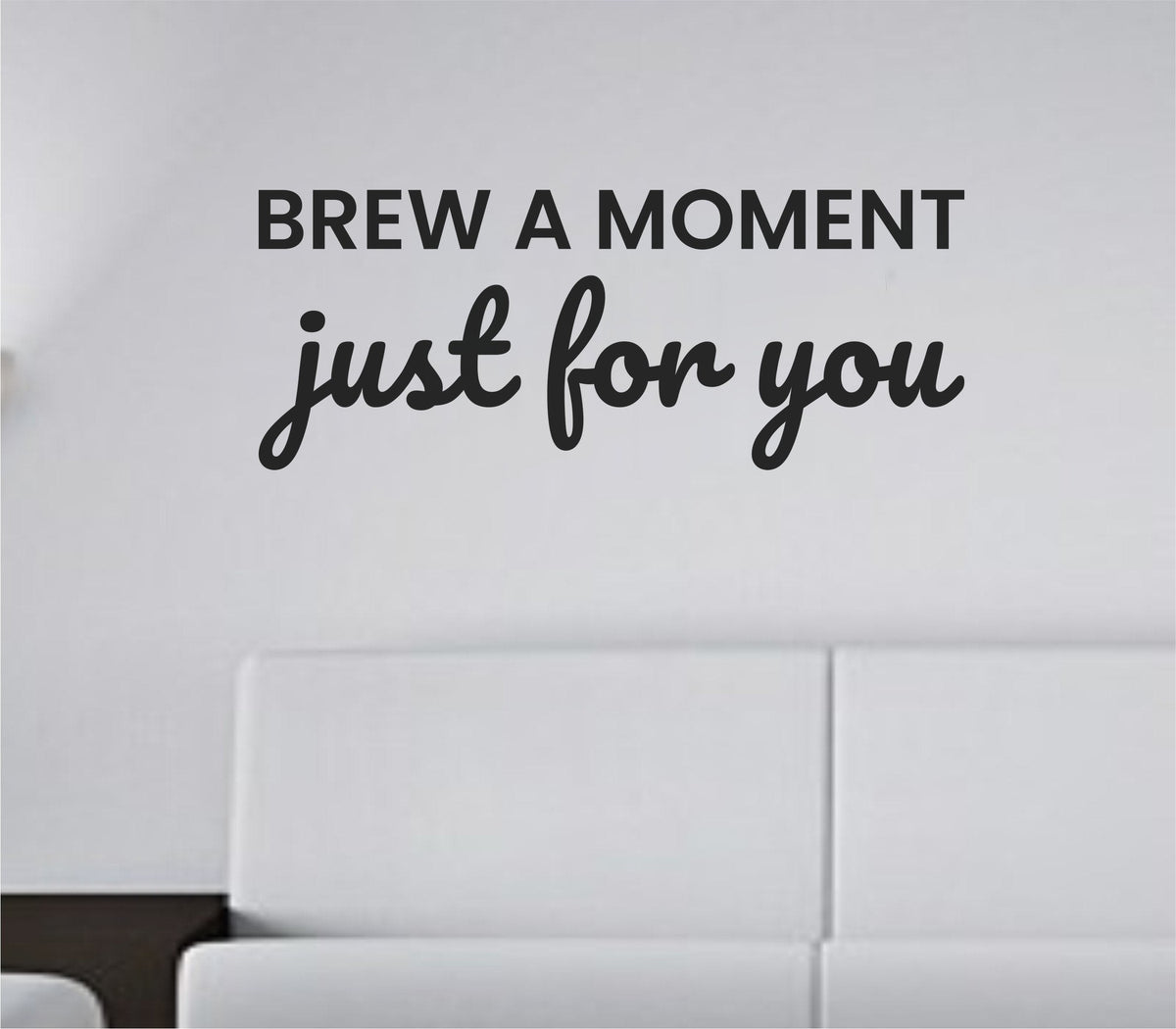 Black vinyl wall decal with the quote 'Brew a moment just for you.' in a simple, elegant script style on a white background.