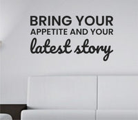 Black vinyl wall decal with the quote 'Bring your appetite and your latest story.' in simple black text on white background.