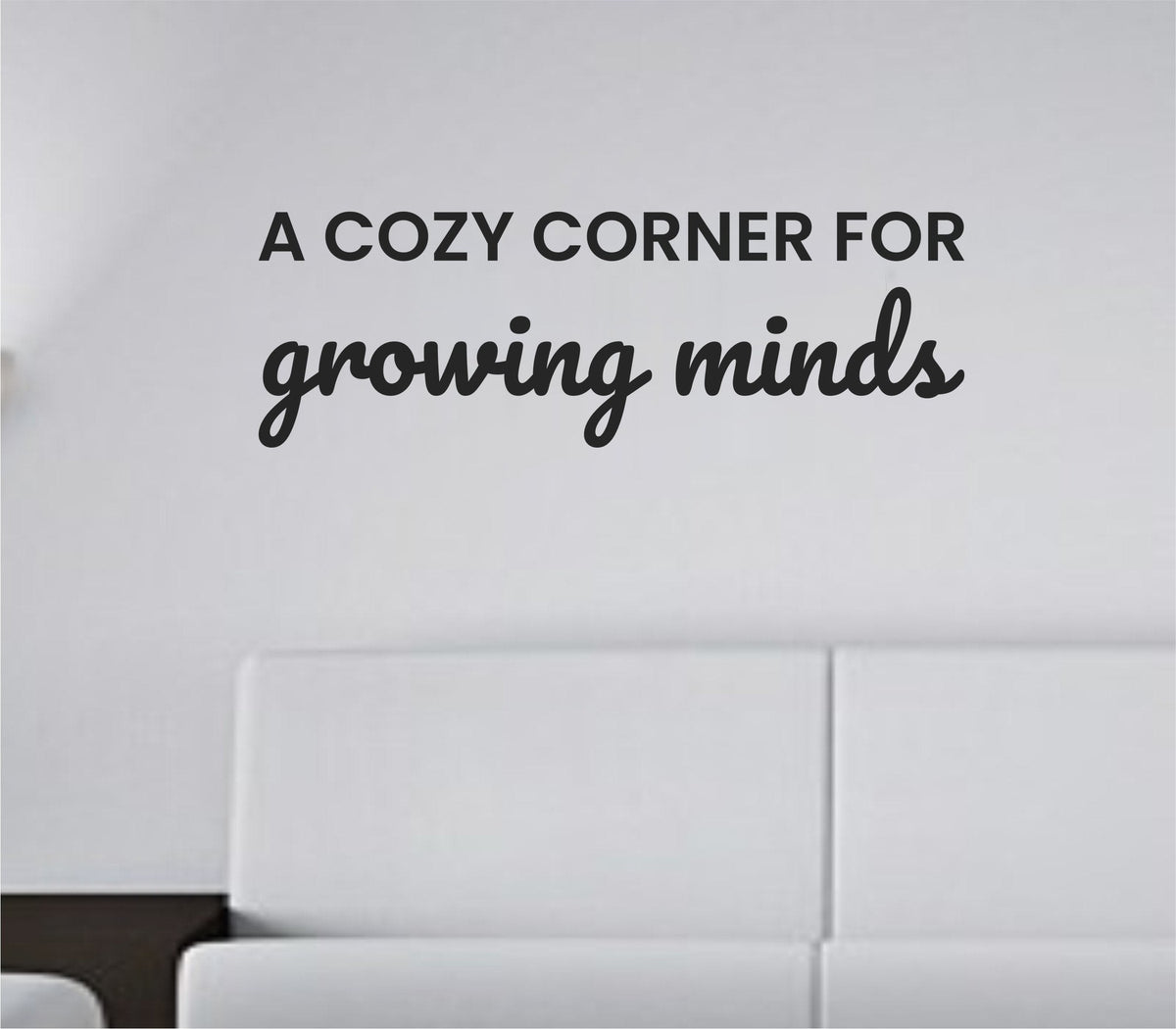 Black vinyl wall decal with the quote A Cozy Corner For Growing Minds in a simple, elegant font on a white background