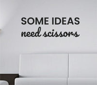 Black vinyl wall decal with the phrase 'Some Ideas Need Scissors' in a clean, modern font on a white background.