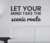 Black one-color vinyl wall decal with the quote Let your mind take the scenic route in a simple, elegant script font on a white background.
