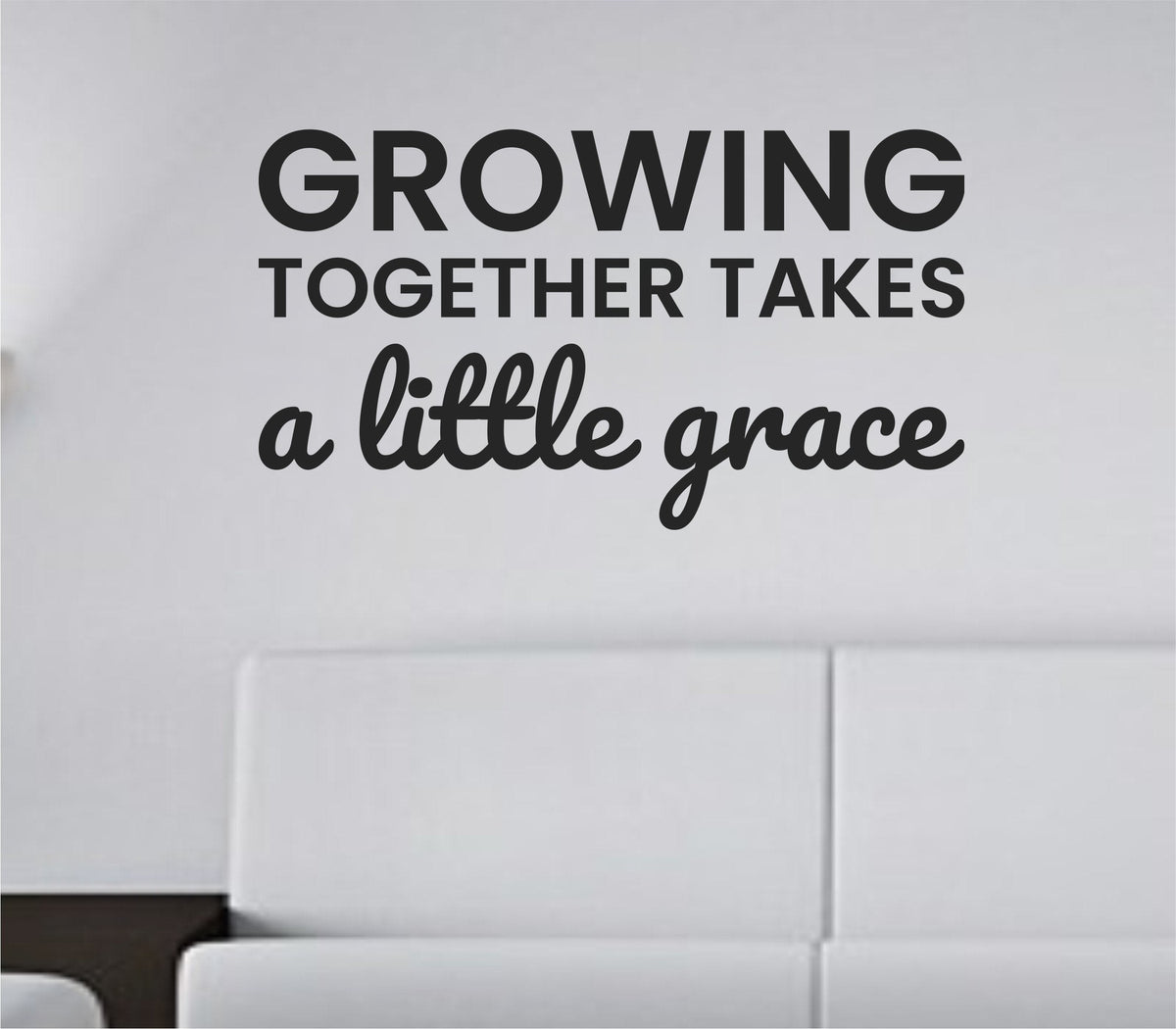 Black vinyl wall decal with the quote "Growing together takes a little grace" in a simple, elegant font on a white background.