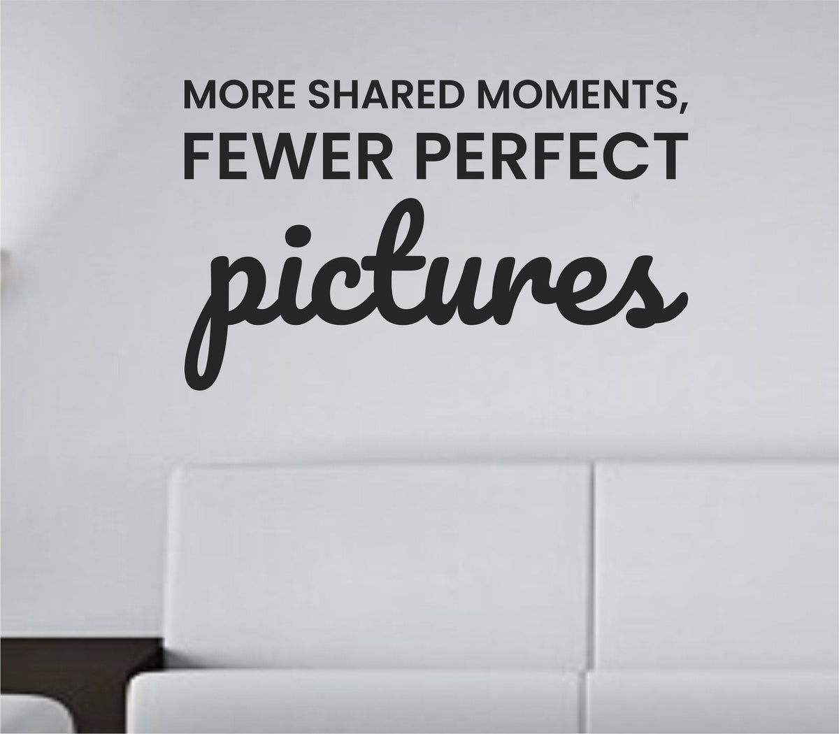 Black vinyl wall decal with the quote More shared moments fewer perfect pictures in a clean, modern font on a white background.