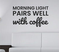 Black vinyl wall decal quote reading 'Morning light pairs well with coffee.' in simple, clean typography on white background.