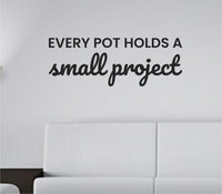 Black vinyl wall decal featuring the quote 'Every pot holds a small project' in a clean simple font on a white background.