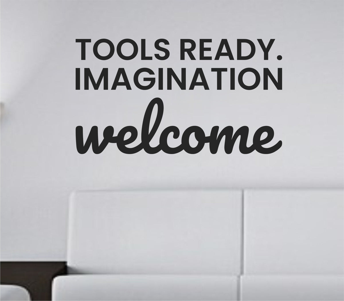 Black vinyl wall decal with the quote 'Tools ready. Imagination welcome.' displayed in a simple, bold font on a white background.