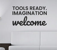 Black vinyl wall decal with the quote 'Tools ready. Imagination welcome.' displayed in a simple, bold font on a white background.