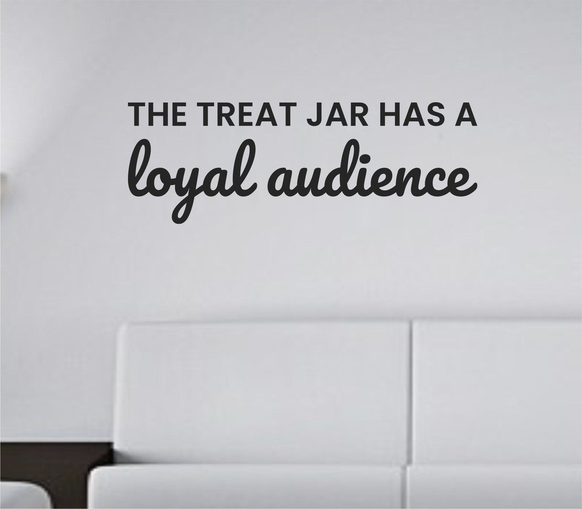 Black vinyl wall decal with the quote 'The treat jar has a loyal audience' in playful font on white background