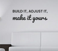 Black vinyl wall decal with the phrase 'Build it, adjust it, make it yours.' in clean simple lettering on white background.