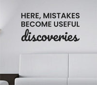 Black vinyl wall decal with the quote 'Here, mistakes become useful discoveries' in a clean modern font on a white background