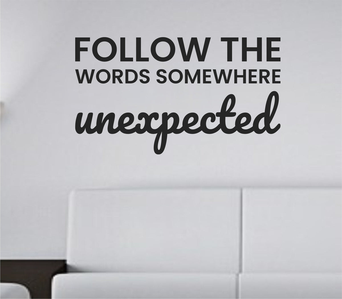 Black vinyl wall decal displaying the phrase Follow the words somewhere unexpected in a clean modern font on a white background.