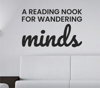 Black vinyl wall decal with the quote 'A reading nook for wandering minds' in a simple, elegant font on a white background.