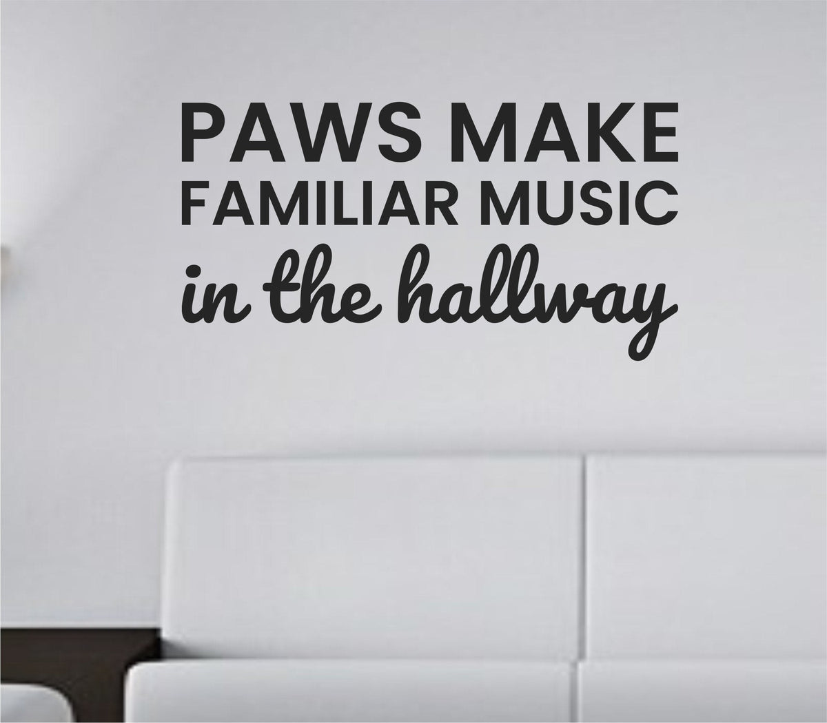 Black vinyl wall decal with the quote 'Paws Make Familiar Music In The Hallway' in a playful, clean font on a white background.