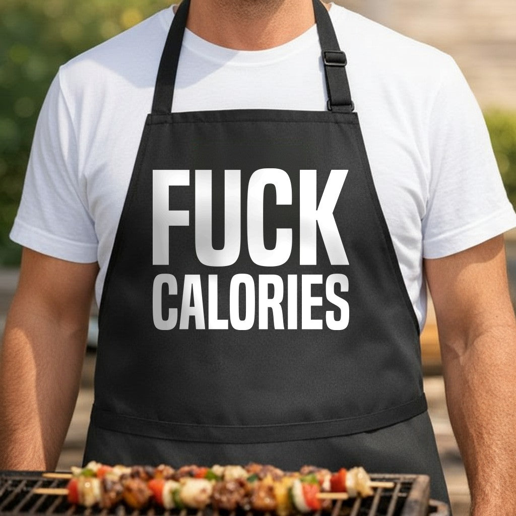 Black apron with large white bold text saying Fuck Calories in block letters, simple and striking design.