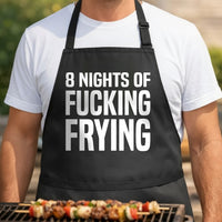 Black apron with bold white text reading Eight Nights Of Fucking Frying in large all-caps font on front
