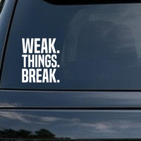 Weak Things Break car decal in the small 6 inch size, shown in the corner of a rear window