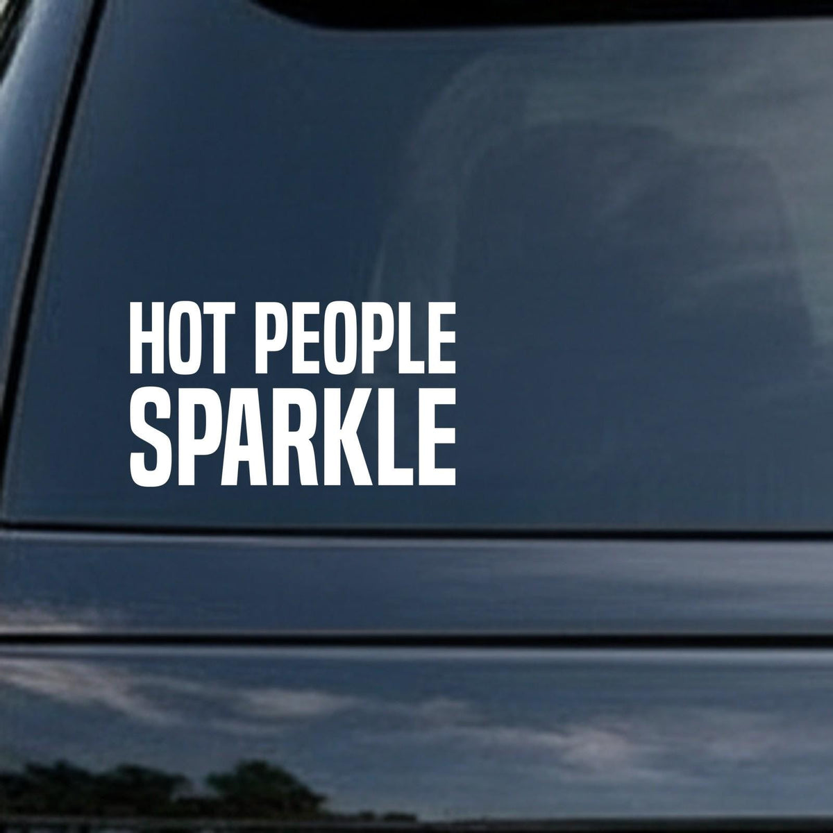 Hot People Sparkle car decal in the small 6 inch size, shown in the corner of a rear window
