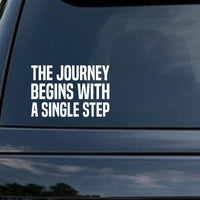 The Journey Begins With a Single Step car decal in the small 6 inch size, shown in the corner of a rear window