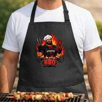 BBQ Masterpiece black BBQ apron, torso close-up: Illustration of a bearded pitmaster chef in a white hat holding ribs and tongs with flames and smoke behind on a black background