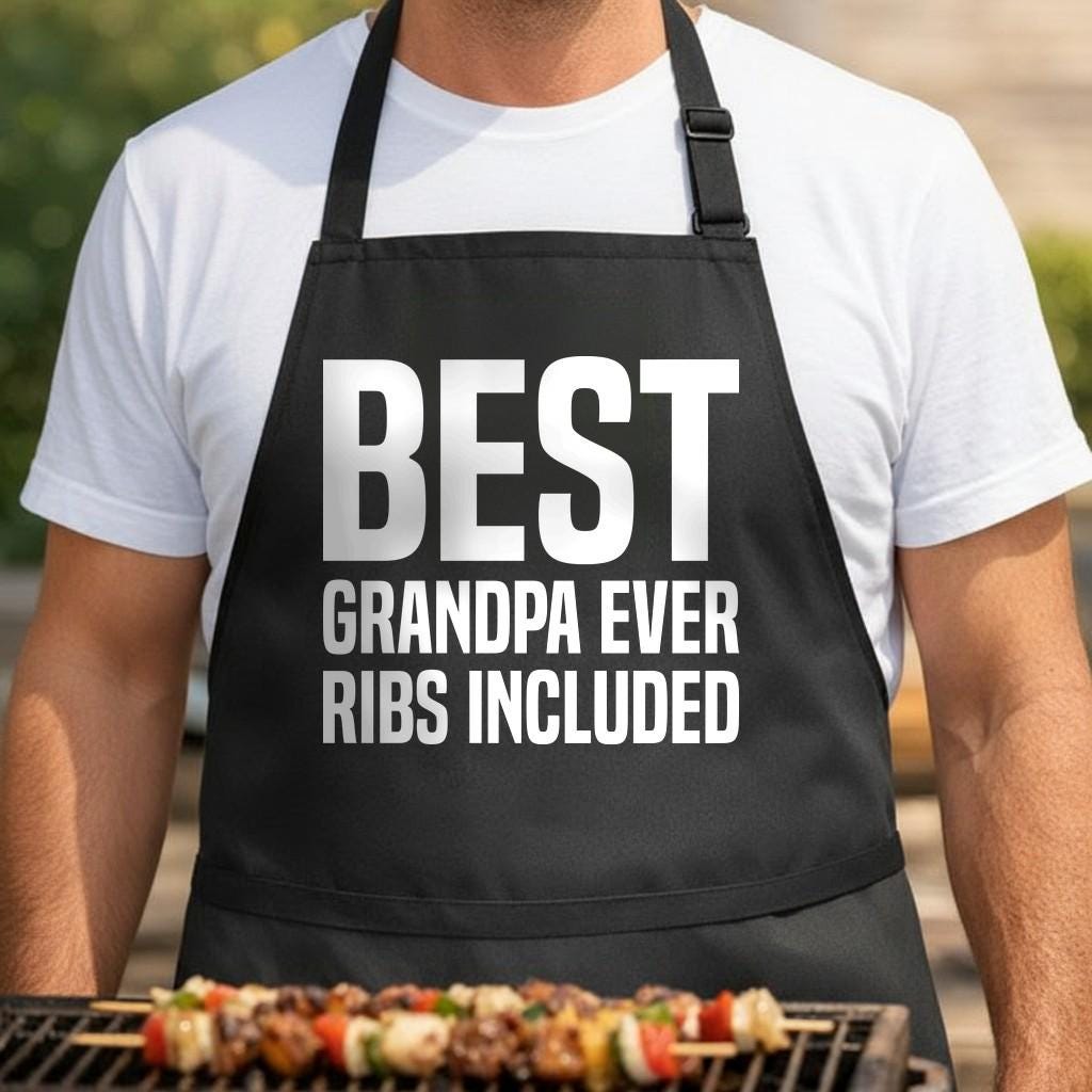 Best Grandpa Ever, Ribs Included black BBQ apron, torso close-up: Black apron with large white bold text reading Best Grandpa Ever Ribs Included in a clean, simple typography style