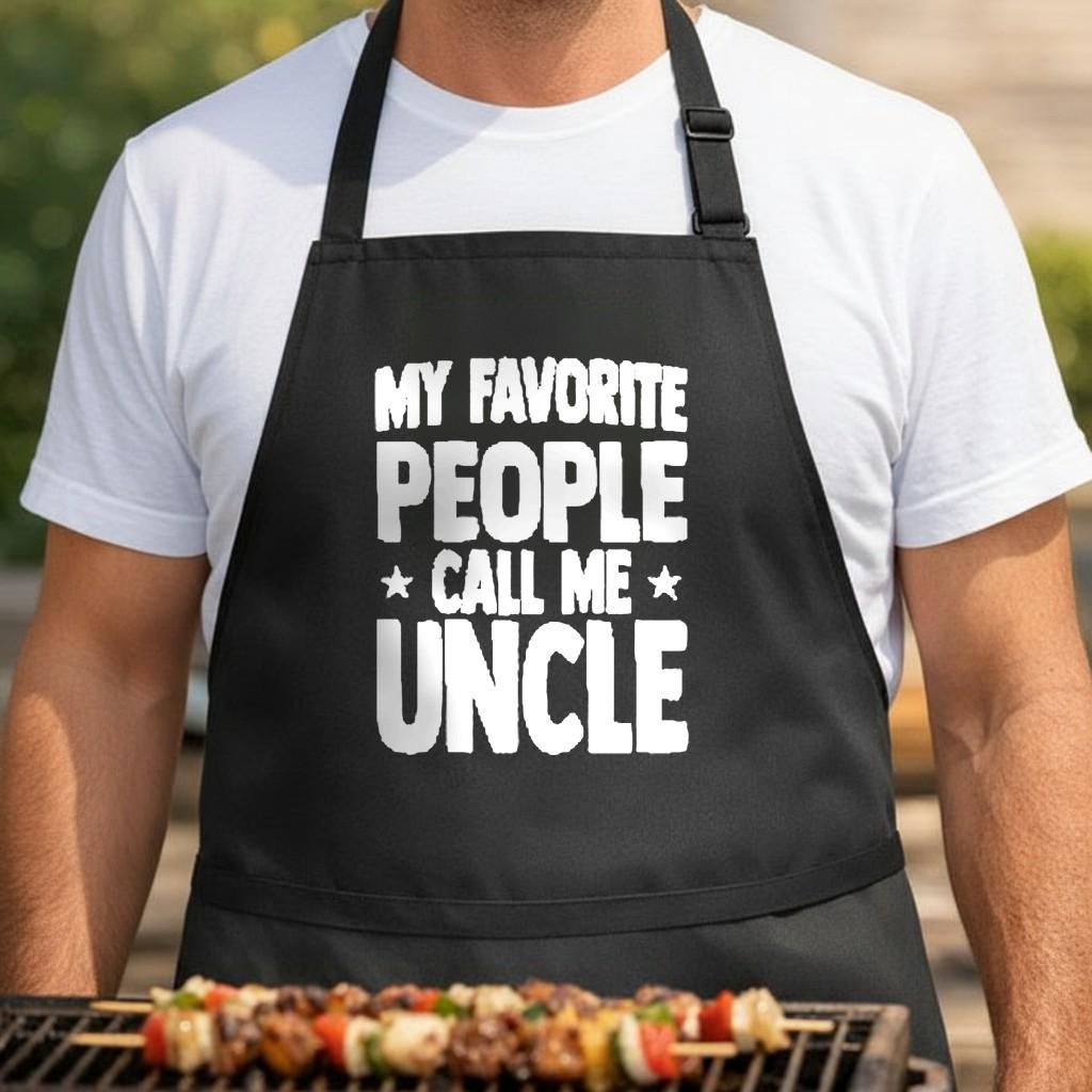 My Favorite People Call Me Uncle black BBQ apron, torso close-up: Black apron with bold white text saying My Favorite People Call Me Uncle in a rustic style font